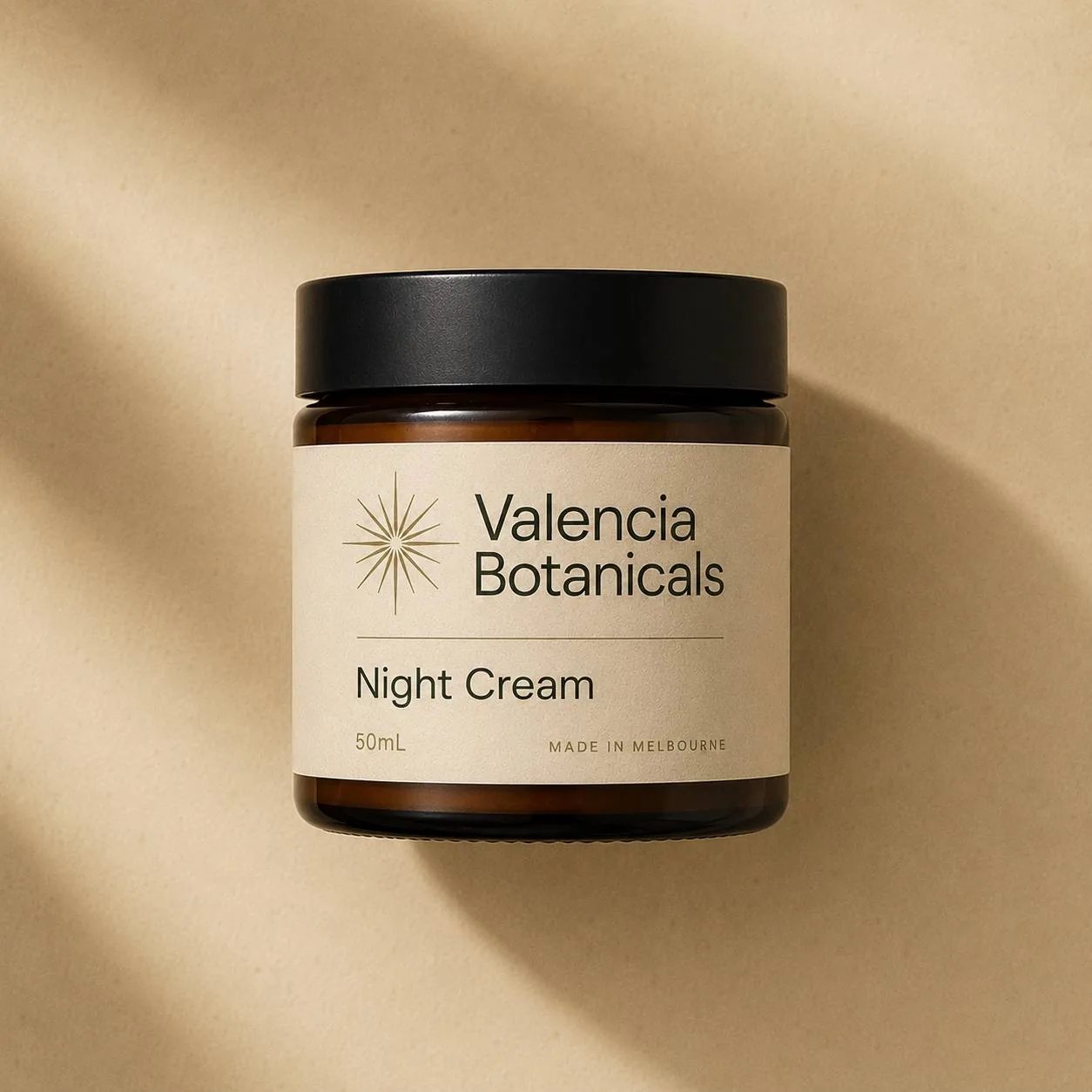 Valencia Botanicals Night Cream — small dark amber glass jar with black lid, 50mL
